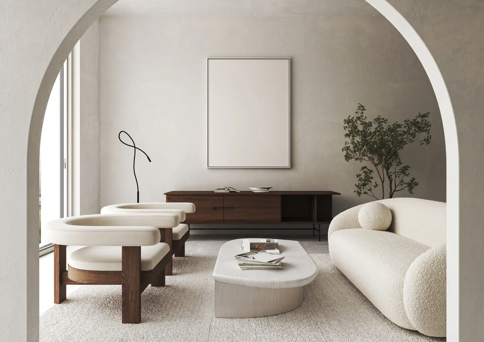 Pale living room framed by a broad archway, with curved seating and low circular tables